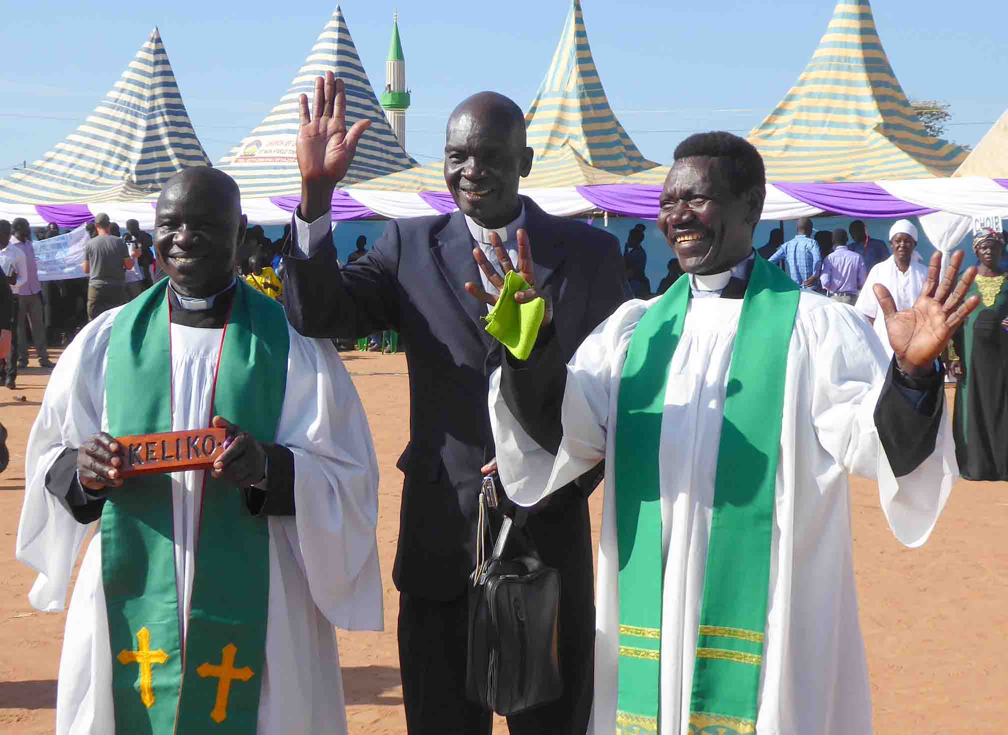 Translators and pastors Ezekiah Dada, Isaac Kenyi and Enos Dada celebrate the completed Keliko New Testament. Photo: April Haberger.